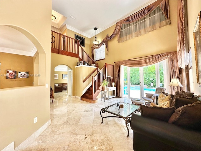 11360 NW 48th Ter, Doral, FL 33178 - living room featuring arched walkways, crown molding, stairs, and a towering ceiling