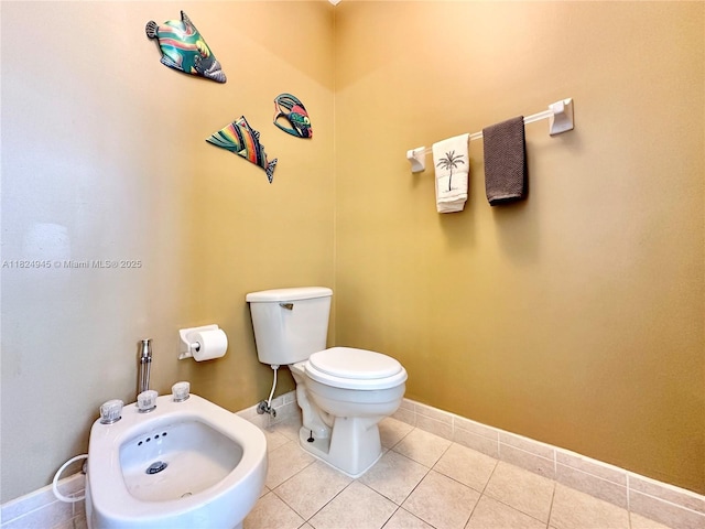 11360 NW 48th Ter, Doral, FL 33178 - bathroom with a bidet and tile patterned flooring