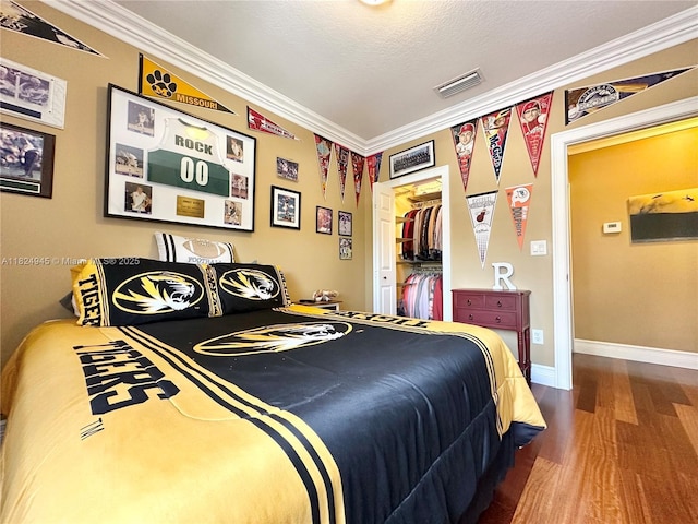 11360 NW 48th Ter, Doral, FL 33178 - bedroom with wood finished floors, crown molding, and a closet