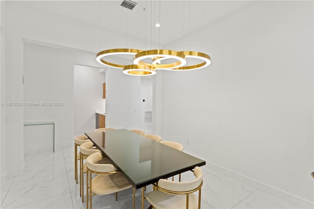 5840 E Brookfield Cir E, Hollywood, FL 33312 - dining room featuring light marble finish floors and baseboards