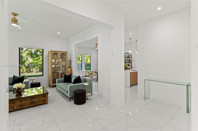 5840 E Brookfield Cir E, Hollywood, FL 33312 - living area with light marble finish flooring, ceiling fan, and recessed lighting