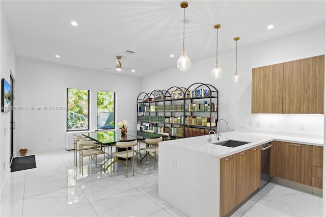 5840 E Brookfield Cir E, Hollywood, FL 33312 - kitchen featuring modern cabinets, brown cabinetry, light marble finish flooring, a peninsula, and ceiling fan