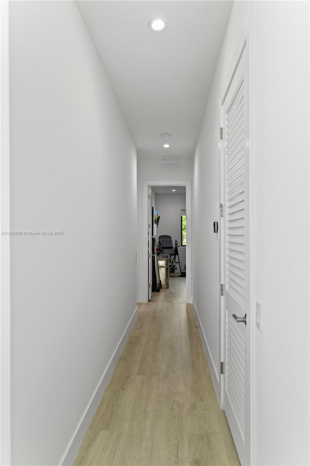 5840 E Brookfield Cir E, Hollywood, FL 33312 - hall featuring light wood-style flooring and recessed lighting
