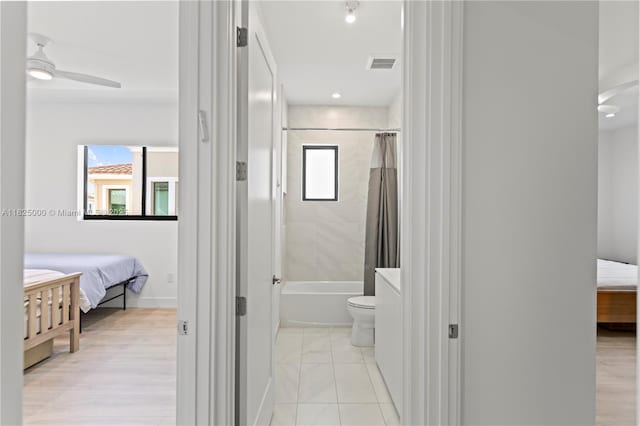 5840 E Brookfield Cir E, Hollywood, FL 33312 - ensuite bathroom featuring plenty of natural light, shower / bathtub combination with curtain, and ceiling fan