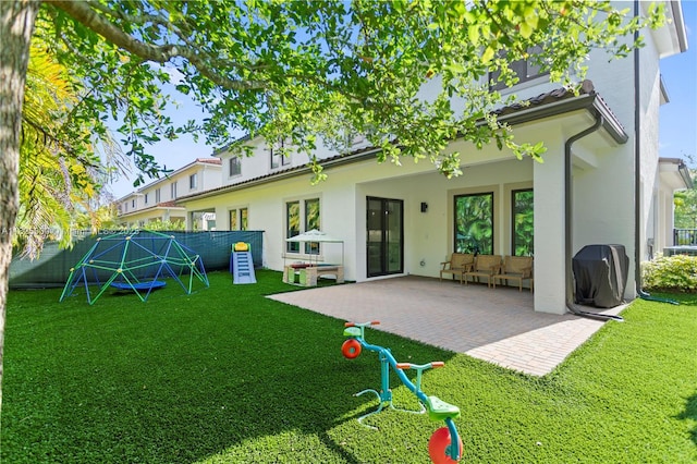 5840 E Brookfield Cir E, Hollywood, FL 33312 - rear view of property with stucco siding, a fenced backyard, and a patio