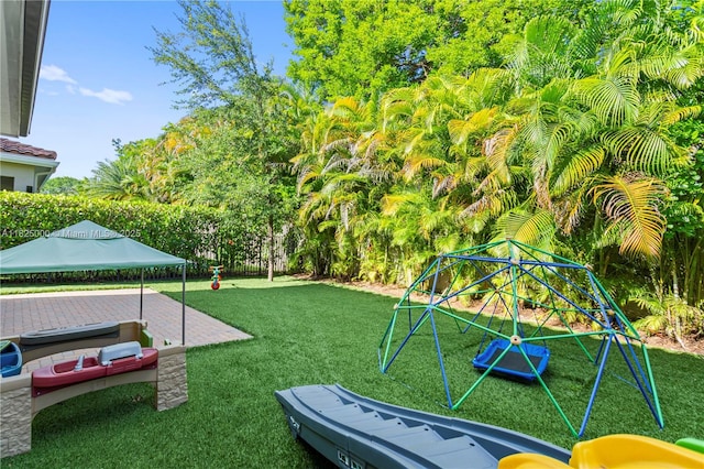 5840 E Brookfield Cir E, Hollywood, FL 33312 - view of grassy yard with a playground
