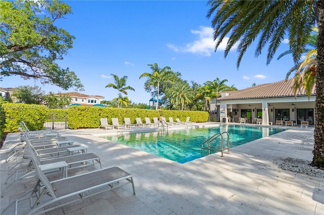 5840 E Brookfield Cir E, Hollywood, FL 33312 - community pool with a patio and a ceiling fan