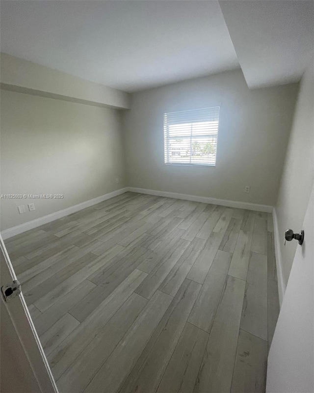 8260 SW 210th St Unit 320, Cutler Bay, FL 33189 - empty room with wood finished floors and baseboards