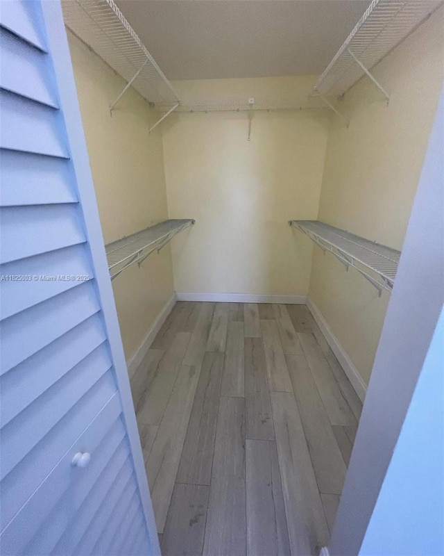 8260 SW 210th St Unit 320, Cutler Bay, FL 33189 - spacious closet featuring wood finished floors