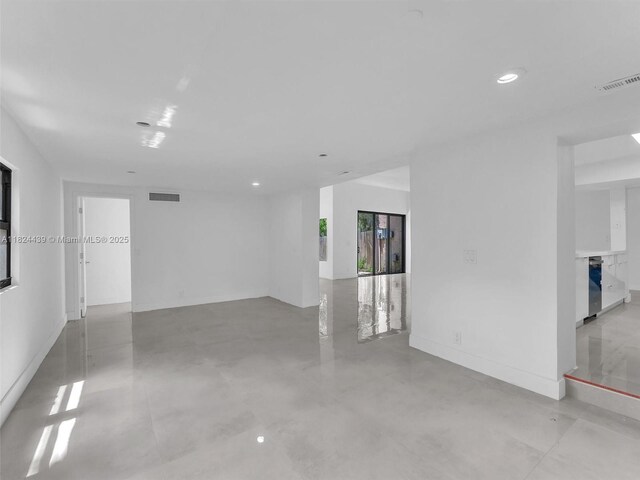3427 Atlanta Dr, Hollywood, FL 33021 - unfurnished room featuring recessed lighting, concrete flooring, and a fireplace