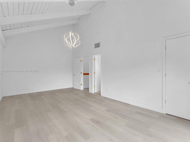 3427 Atlanta Dr, Hollywood, FL 33021 - spare room with a chandelier, light wood finished floors, high vaulted ceiling, and a wooden ceiling with exposed beams