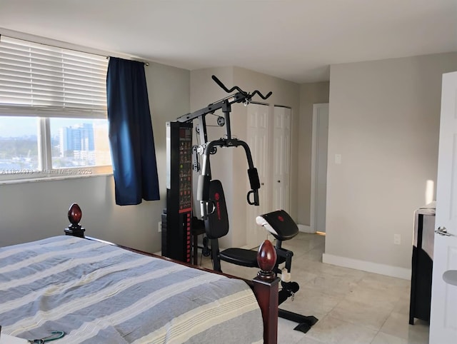 6900 Bay Dr Unit 11K, Miami Beach, FL 33141 - bedroom with light tile patterned floors and baseboards