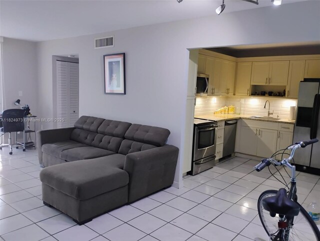 6900 Bay Dr Unit 11K, Miami Beach, FL 33141 - living room with light tile patterned flooring