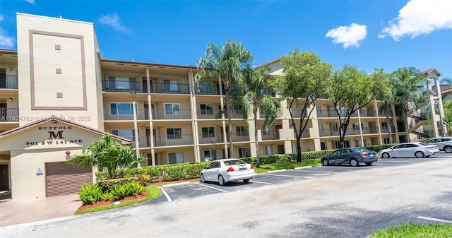 901 SW 141st Ave Unit 303M, Pembroke Pines, FL 33027 - view of apartment building / complex with uncovered parking