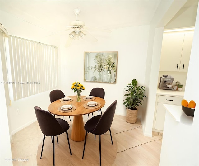 901 SW 141st Ave Unit 303M, Pembroke Pines, FL 33027 - dining space with ceiling fan and light wood-style floors