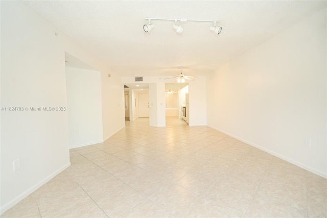 901 SW 141st Ave Unit 303M, Pembroke Pines, FL 33027 - spare room with a ceiling fan, light tile patterned floors, and track lighting