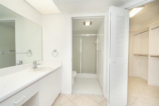 901 SW 141st Ave Unit 303M, Pembroke Pines, FL 33027 - full bath with tile patterned flooring, vanity, a stall shower, and a spacious closet