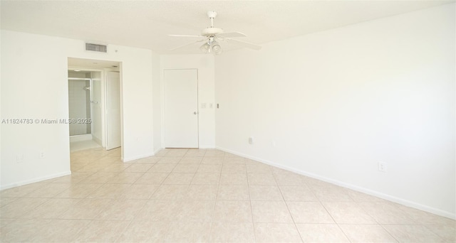 901 SW 141st Ave Unit 303M, Pembroke Pines, FL 33027 - unfurnished bedroom featuring ceiling fan and light tile patterned floors