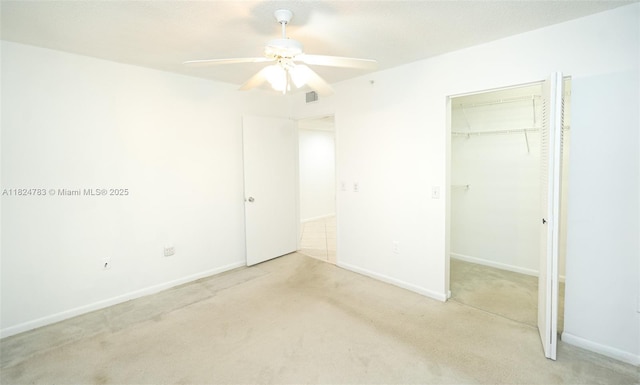 901 SW 141st Ave Unit 303M, Pembroke Pines, FL 33027 - unfurnished bedroom featuring carpet, a closet, and ceiling fan