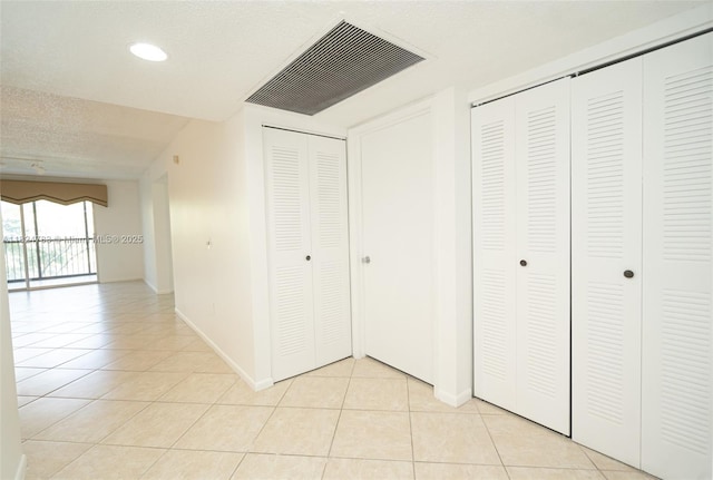 901 SW 141st Ave Unit 303M, Pembroke Pines, FL 33027 - hallway with light tile patterned floors and recessed lighting