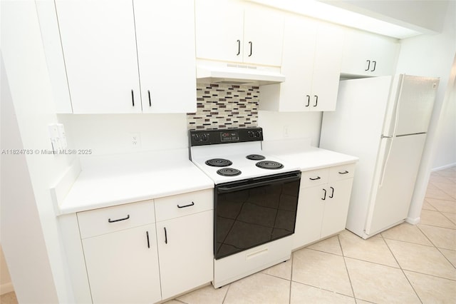 901 SW 141st Ave Unit 303M, Pembroke Pines, FL 33027 - kitchen featuring electric range oven, under cabinet range hood, freestanding refrigerator, tasteful backsplash, and light countertops