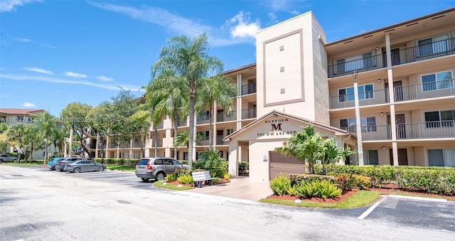901 SW 141st Ave Unit 303M, Pembroke Pines, FL 33027 - view of apartment building / complex featuring uncovered parking