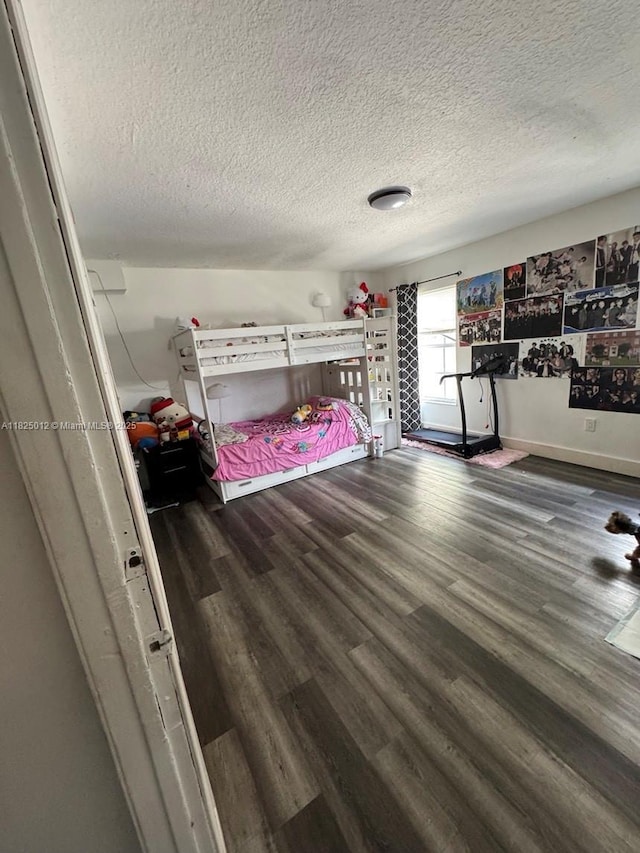 791 E 18th St, Hialeah, FL 33013 - bedroom with a textured ceiling and wood finished floors
