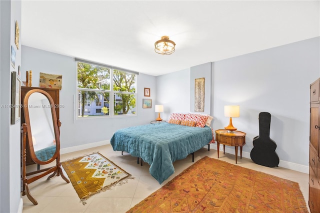 114 Royal Park Dr Unit 2B, Oakland Park, FL 33309 - bedroom with baseboards and light tile patterned floors
