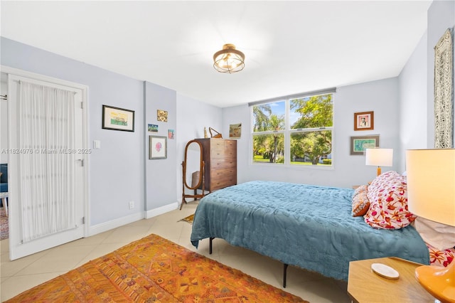 114 Royal Park Dr Unit 2B, Oakland Park, FL 33309 - tiled bedroom featuring baseboards