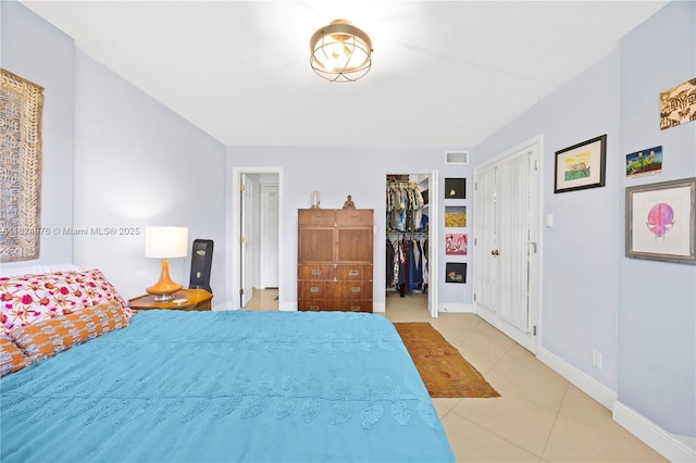 114 Royal Park Dr Unit 2B, Oakland Park, FL 33309 - bedroom with tile patterned floors, a spacious closet, and a closet