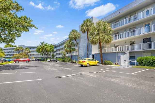 114 Royal Park Dr Unit 2B, Oakland Park, FL 33309 - view of apartment building / complex featuring uncovered parking