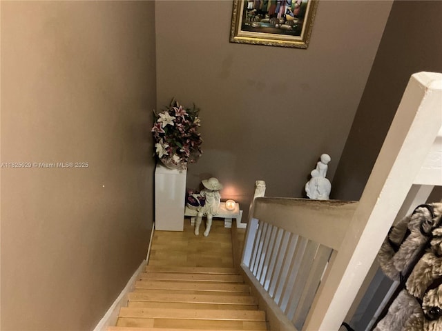 4925 W Lakes Dr, Deerfield Beach, FL 33442 - stairway featuring wood finished floors and baseboards