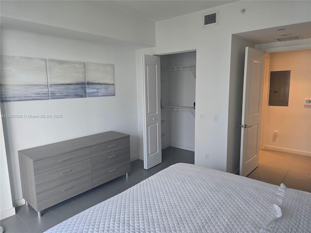 1600 NE 1st Ave Unit 3017, Miami, FL 33132 - bedroom featuring electric panel, tile patterned floors, a closet, and a walk in closet