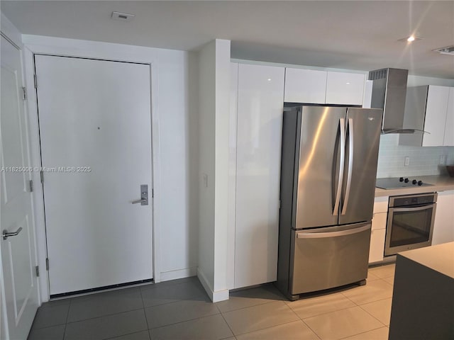 1600 NE 1st Ave Unit 3017, Miami, FL 33132 - kitchen with appliances with stainless steel finishes, wall chimney range hood, light tile patterned flooring, and backsplash