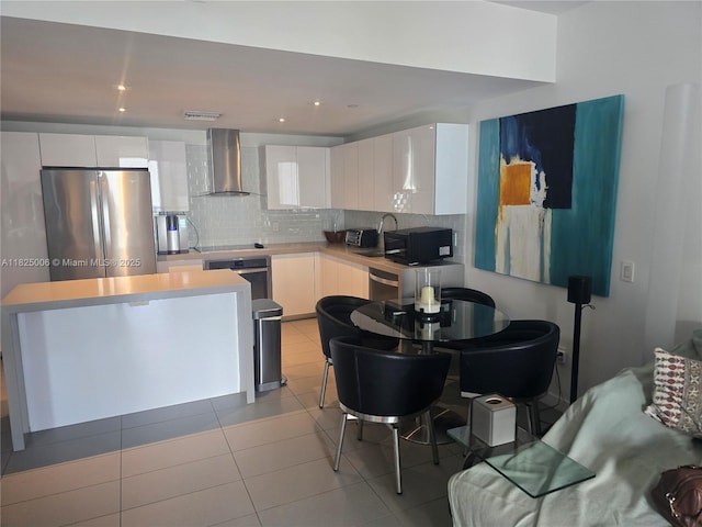 1600 NE 1st Ave Unit 3017, Miami, FL 33132 - kitchen featuring wall chimney exhaust hood, black appliances, and white cabinetry