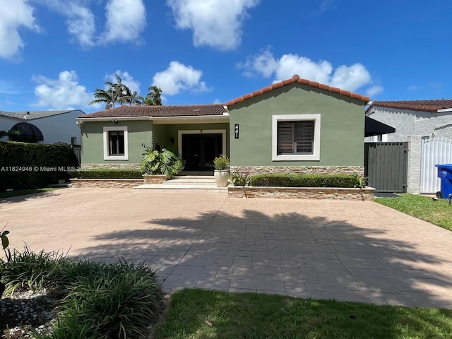 441 SW 27th Rd, Miami, FL 33129 - view of front of house featuring stucco siding and a tile roof