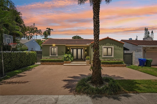 441 SW 27th Rd, Miami, FL 33129 - view of front of house featuring stucco siding and a tile roof