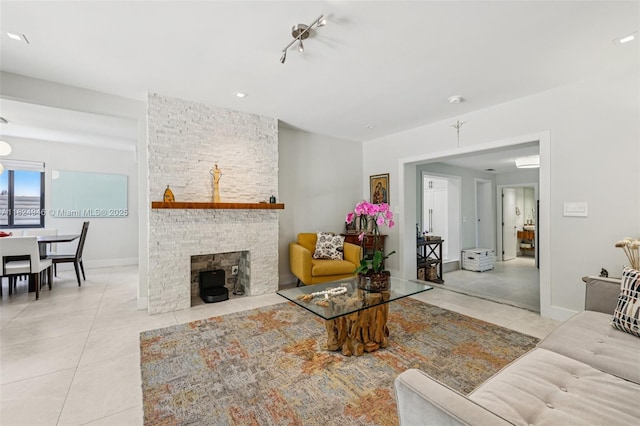 441 SW 27th Rd, Miami, FL 33129 - living area featuring tile patterned floors and a stone fireplace