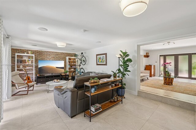 441 SW 27th Rd, Miami, FL 33129 - living area with brick wall and light tile patterned floors