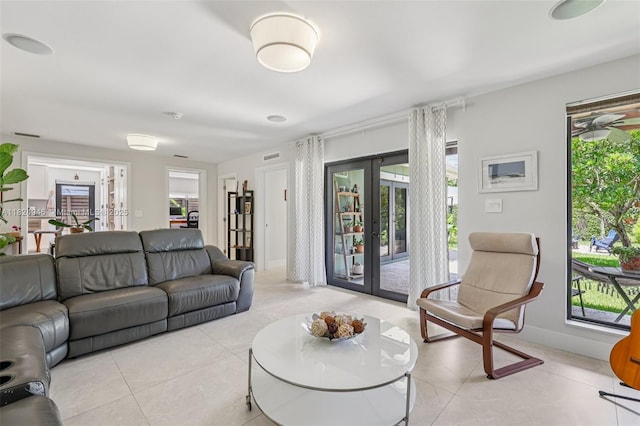 441 SW 27th Rd, Miami, FL 33129 - living room featuring french doors and light tile patterned floors