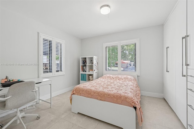 441 SW 27th Rd, Miami, FL 33129 - bedroom featuring a desk and light tile patterned floors
