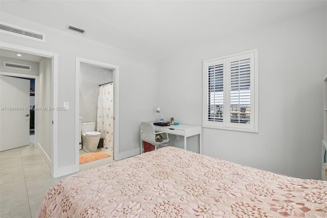 441 SW 27th Rd, Miami, FL 33129 - bedroom with light tile patterned floors and connected bathroom