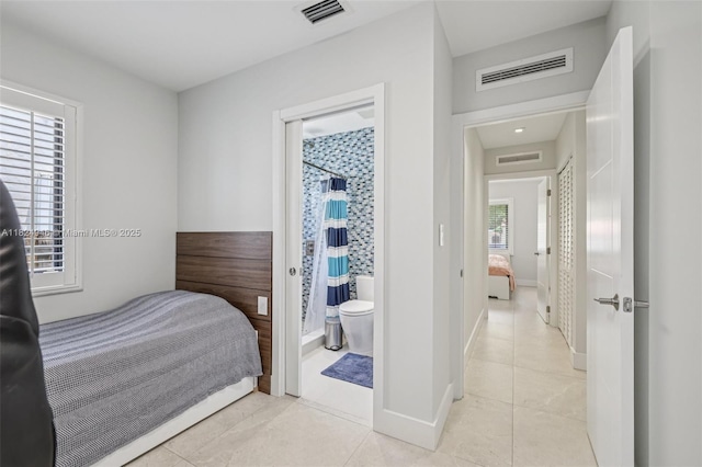 441 SW 27th Rd, Miami, FL 33129 - bedroom with light tile patterned flooring and connected bathroom