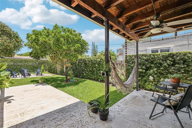 441 SW 27th Rd, Miami, FL 33129 - fenced backyard featuring a patio area, a ceiling fan, and an outdoor fire pit