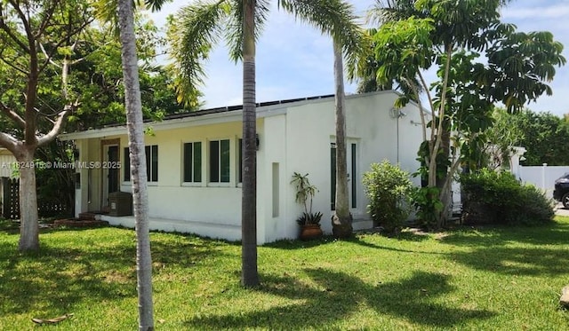 1607 Moffett St, Hollywood, FL 33020 - view of side of property with stucco siding