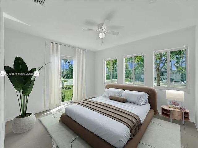 1607 Moffett St, Hollywood, FL 33020 - bedroom featuring multiple windows, light tile patterned flooring, and a ceiling fan