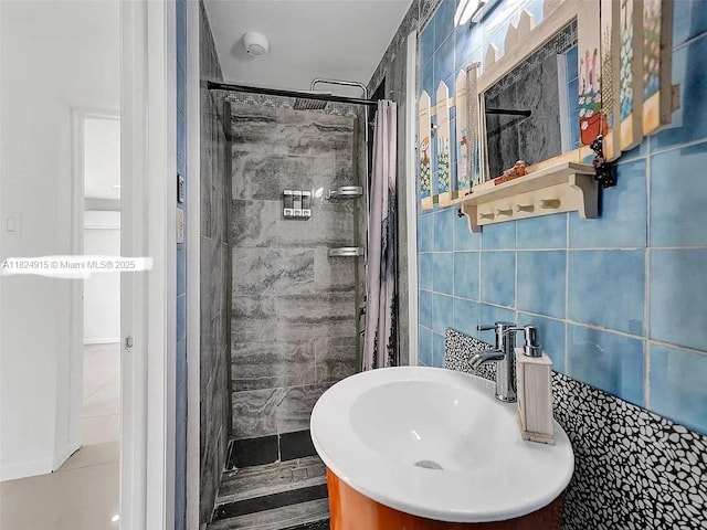 1607 Moffett St, Hollywood, FL 33020 - bathroom with a tile shower, tile walls, and decorative backsplash
