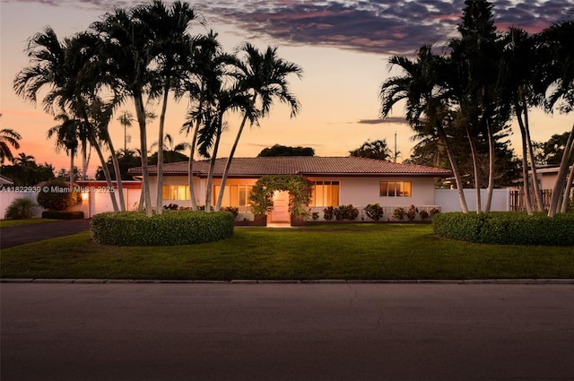 435 NE 36th St, Boca Raton, FL 33431 - ranch-style house featuring a tiled roof, stucco siding, a garage, and driveway