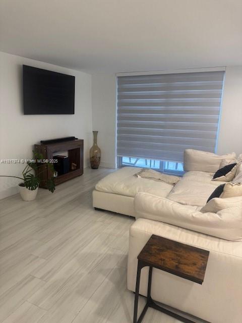 6039 Collins Ave Unit 1516, Miami Beach, FL 33140 - living area featuring baseboards