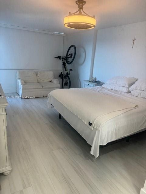 6039 Collins Ave Unit 1516, Miami Beach, FL 33140 - bedroom featuring wood finished floors